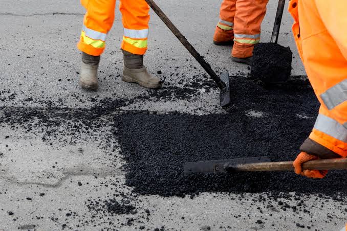 South Florida Paving Inc. crew led by owner Charlie Hicks working on an asphalt repair in Plantation, FL
